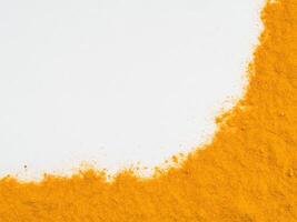 Turmeric Powder on white with copy space photo