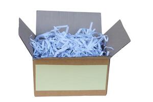 Box contains sliced used paper to be small stripes, prepare to recycle process. isolated on white background. Concept, Waste or garbage management. Documents shredded for security purposes. photo