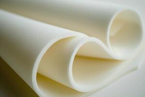 Close up of white memory foam creating abstract shapes photo