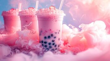 Dreamy pink bubble tea with tapioca pearls and ice cubes, topped with whipped cream and a strawberry slice, surrounded by vapor clouds. photo