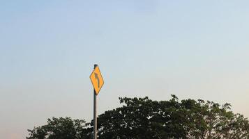traffic sign sign turn left on a yellow background photo