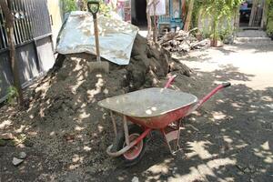 close up Artco or cement cart is used to transport cement sand and stone photo