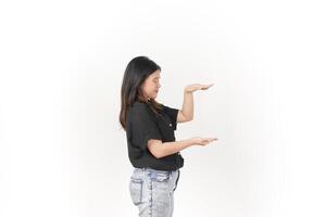 Young Asian woman Measuring and Showing Big Product wearing Black t-shirt and jeans isolated on white background photo