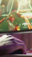 Vertical Gamer using keyboard and mouse to play FPS singleplayer videogame on PC, enjoying leisure time. Person in apartment at night using high tech computer peripherals to destroy enemies, camera B close up video