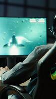 Vertical Man feeling happy while playing science fiction videogames on computer desktop, celebrating victory. Cheerful gamer overjoyed after winning game on gaming PC, close up, camera A video