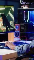 Vertical Gamer feeling annoyed after losing online multiplayer action videogame match, being outsmarted by rival players. Dejected man hitting desk after seeing game over message on computer screen, camera A video
