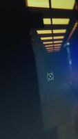 Vertical Computer screen showing FPS videogame with futuristic weapon shooting laser bullets at flying robots. Extreme close up of POV shooting videogame on PC in living room with no people in video
