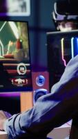 Vertical Man frustrated after receiving game over message on computer display while playing videogames on PC. Gamer annoyed after being defeated by opposing players in online competition, camera A video
