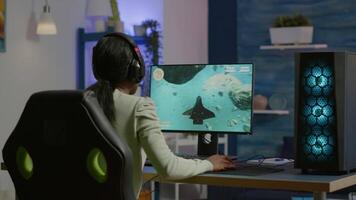 Professional eSport gamer putting headset before playing in competitive games on cyber gaming tournament. Virtual championship in cyberspace, esports player performing on RGB powerful computer video
