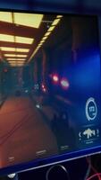 Vertical Videogame with gun and health, stamina, ammo HUDs left open on PC monitor in empty neon illuminated apartment. Close up of first person shooter game on computer display in home room late at night video