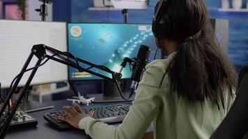 Pro cyber streamer losing videogame tournament while wearing professional headset talking on stream chat. Defeated gamer using RGB powerfull computer for online competition late at night in gaming room video