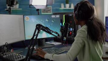 Nevous black streamer losing videogame, game over for african woman cyber playing online space shooter games with headset. Player performing on powerful computer talking with players on stream chat video