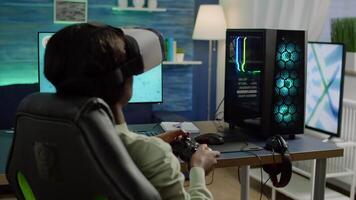 Back view of black woman gamer wearing virtual reality headset playing with joystick space shooter videogames on online tournement. Defeated player using wireless controller for online competition video