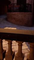 A close up of a railing with a brick building in the background video