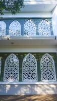 Artistic photo of a mosque wall which has the impression of Islamic religious symbols