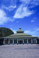 view of the mosque with a wide expanse of mountains and blue sky photo