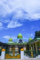 The view of the mosque and its dome can be seen from the front, creating an amazing view photo