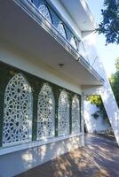 Artistic photo of a mosque wall which has the impression of Islamic religious symbols