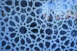 Artistic photo of a mosque wall which has the impression of Islamic religious symbols