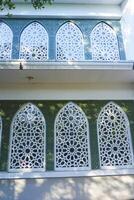 Artistic photo of a mosque wall which has the impression of Islamic religious symbols