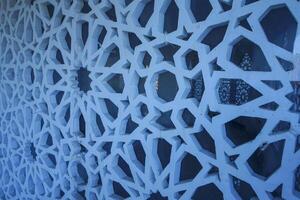 Artistic photo of a mosque wall which has the impression of Islamic religious symbols