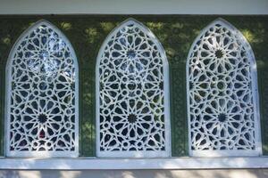 Artistic photo of a mosque wall which has the impression of Islamic religious symbols