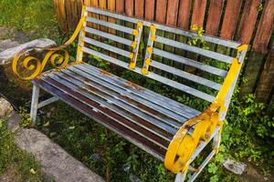 yellow waiting chairs on the side of the road, creating a romantic atmosphere photo