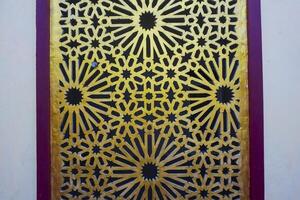 Artistic photo of a mosque wall which has the impression of Islamic religious symbols