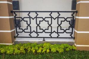 the texture of the mosque fence is green and yellow during the day photo