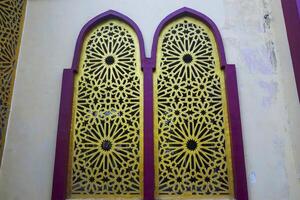 Artistic photo of a mosque wall which has the impression of Islamic religious symbols