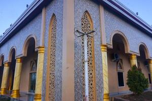 Artistic photo of a mosque wall which has the impression of Islamic religious symbols