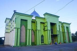 the view of the mosque and its dome looks out, creating a stunning view photo