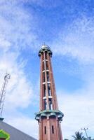 The mosque's minaret rises high against the blue sky, adding to the atmosphere of majesty photo