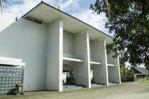 New house with wooden door and empty white walls. suitable for example images photo