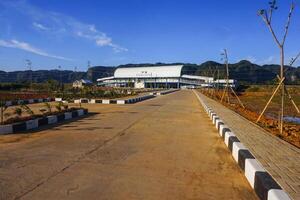 The road to the train station is set against a blue sky, creating a romantic atmosphere photo