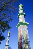 The mosque's minaret rises high against the blue sky, adding to the atmosphere of majesty photo