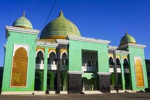 the view of the mosque and its dome looks out, creating a stunning view photo
