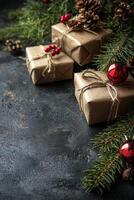 Holiday pine and red berry arrangement on a dark textured surface photo
