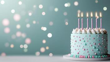 Colorful birthday cake with candles and festive decorations on a soft background photo