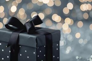 Elegant Black Gift Box With Ribbon Against a Bokeh Background photo