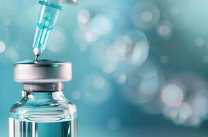 Syringe With Droplet Ready for Medical Injection in Bright Laboratory Environment photo
