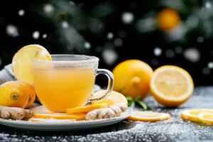 Refreshing Lemonade With Lemons on a Snowy Table in Winter photo