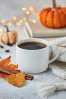 Cozy Autumn Morning With Coffee, Pumpkins, and Colorful Leaves photo