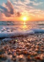 Sunset Over Ocean Waves Reflecting Colors at Beach During Golden Hour photo