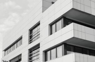 Modern Architectural Building With Sleek Lines and Large Windows in Urban Setting photo