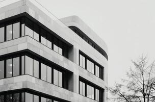Modern Architectural Building With Sleek Lines and Large Windows in Urban Setting photo
