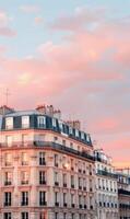 Scenic Parisian Buildings Against a Colorful Sunset Sky photo