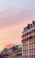 Scenic Parisian Buildings Against a Colorful Sunset Sky photo