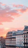 Scenic Parisian Buildings Against a Colorful Sunset Sky photo