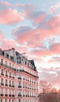 Scenic Parisian Buildings Against a Colorful Sunset Sky photo